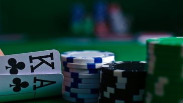 white and black dice on green table